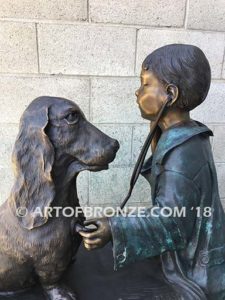 Future Vet bronze sculpture of veterinarian boy with stethoscope and dog on bench