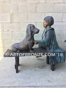Future Vet bronze sculpture of veterinarian boy with stethoscope and dog on bench