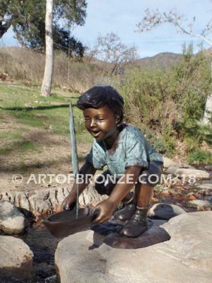 Junior Sailor bronze sculpture of young boy with sailboat in his hands