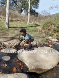 Junior Sailor bronze sculpture of young boy with sailboat in his hands