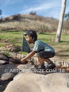 Junior Sailor bronze sculpture of young boy with sailboat in his hands