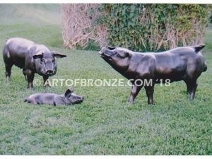 Free Range bronze cast playful life-size adult pig and piglets playing together