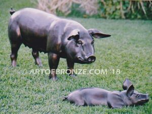 Free Range bronze cast playful life-size adult pig and piglets playing together
