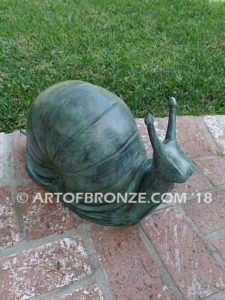 On the Move bronze snail artwork for outdoor garden or indoor display