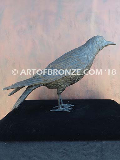 Raven bronze sculpture of life-size raven looking straight ahead