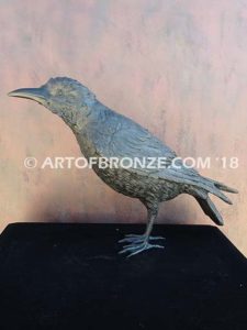 Raven bronze sculpture of life-size raven looking straight ahead