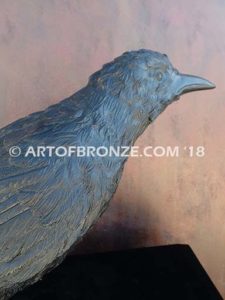 Raven bronze sculpture of life-size raven looking straight ahead