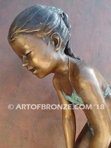 Pond Fun bronze sculpture of young girl in bathing suit playing with bullfrog