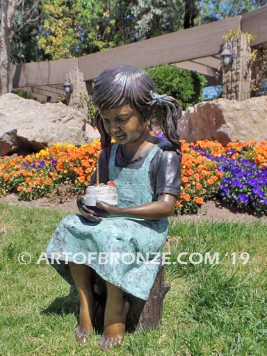 Birthday Wishes bronze statue of girl with birthday cake