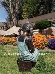 Birthday Wishes back view bronze statue of girl with birthday cake