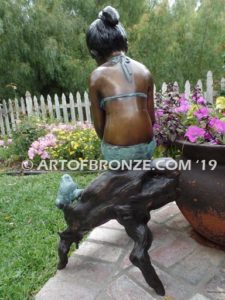 Prince Charming bronze sculpture of bullfrog and girl in bathing suit