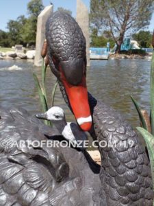 Black Swan outdoor life-size statue of swan and playing cygnets