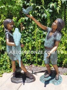 Bird Lovers front view bronze statue of two girls playing with their pet birds
