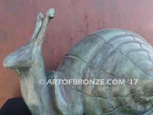 On the Move bronze snail artwork for outdoor garden or indoor display