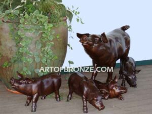 Free Range bronze cast playful life-size adult pig and piglets playing together