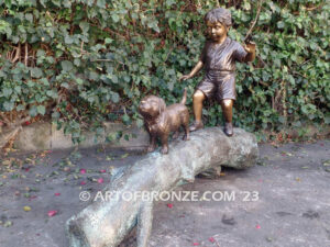 Adventurous Pals Bronze monumental sculpture for garden or yard of boy and dog crossing bronze log