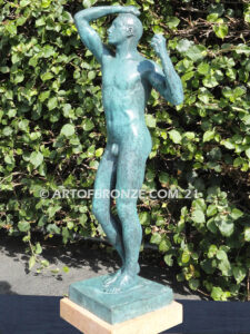 Age of Bronze figurative bronze statue of nude male with tightened musculature and twisting body