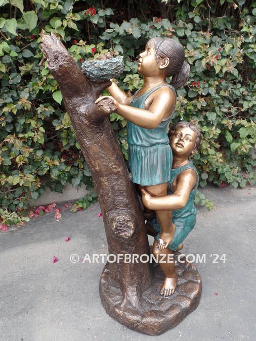 Baby Rescue Bronze Statue of children rescuing baby birds in tree