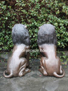 Beauty & Strength high quality cast bronze African lion pair sitting next to each other