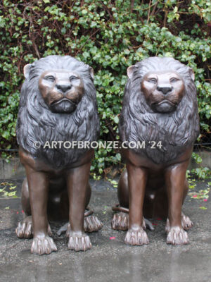 Beauty & Strength high quality cast bronze African lion pair sitting next to each other