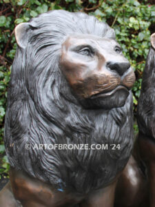 Beauty & Strength high quality cast bronze African lion pair sitting next to each other