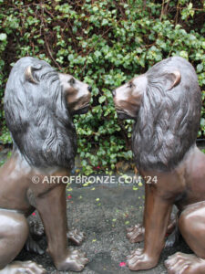 Beauty & Strength high quality cast bronze African lion pair sitting next to each other