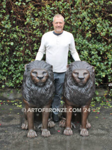 Beauty & Strength high quality cast bronze African lion pair sitting next to each other