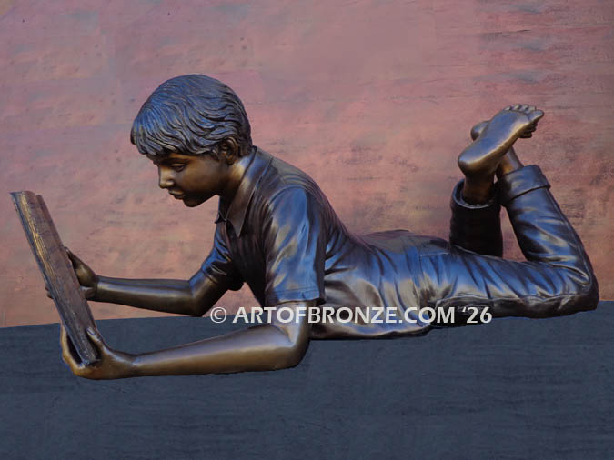 Best in His Class bronze sculpture of young boy reading his favorite novel