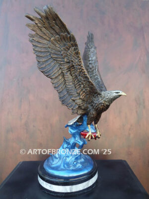 Bronze statue of flying eagle with captured salmon on custom marble base