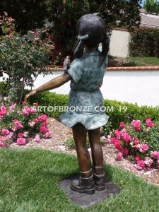 Birds of Joy front view bronze statue of standing girl w/ dress and birds in hands