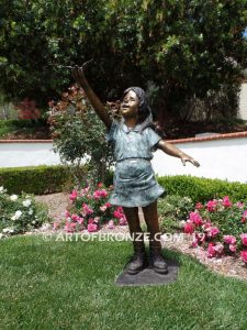 Birds of Joy front view bronze statue of standing girl w/ dress and birds in hands