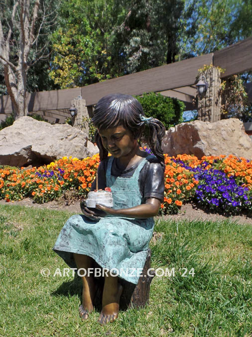 Birthday Wishes bronze statue of girl with birthday cake