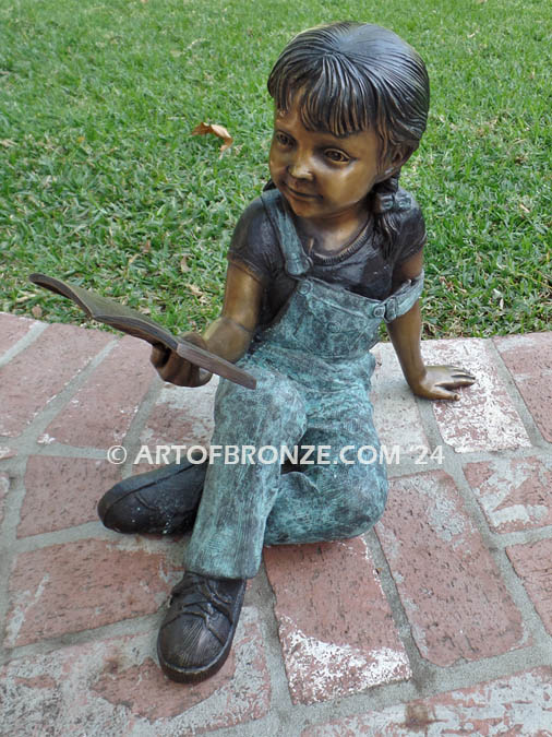 Book Smart bronze statue of young girl sitting down reading book