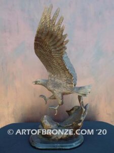 Bronze sculpture of flying eagle on custom marble base