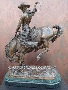The Buckaroo bronze statue after Phimister Proctor featuring cowboy on horse