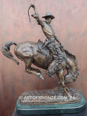 The Buckaroo bronze statue after Phimister Proctor featuring cowboy on horse