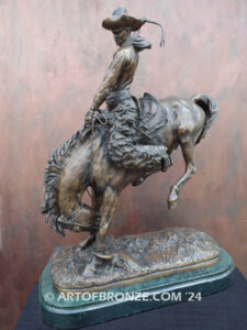 The Buckaroo bronze statue after Phimister Proctor featuring cowboy on horse