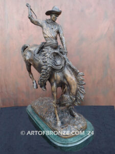 The Buckaroo bronze statue after Phimister Proctor featuring cowboy on horse