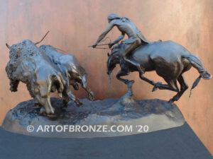 Buffalo Hunt bronze sculpture of Native American Indian on horse charging two bison.