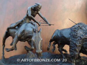 Buffalo Hunt bronze sculpture of Native American Indian on horse charging two bison.