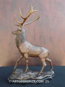 bull elk standing on rocky base design with head raised in bugling position bronze sculpture