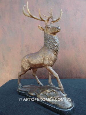 bull elk standing on rocky base design with head raised in bugling position bronze sculpture