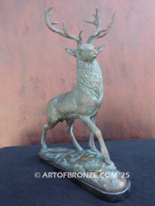 bull elk standing on rocky base design with head raised in bugling position bronze sculpture