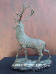 bull elk standing on rocky base design with head raised in bugling position bronze sculpture