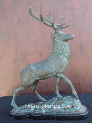 bull elk standing on rocky base design with head raised in bugling position bronze sculpture