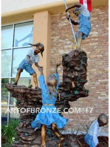 Celebrating Old Glory heroic bronze commission children climbing rock with flag