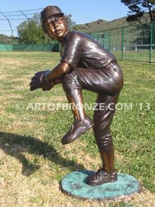 Championship Game bronze baseball player statues featuring a boy pitching and hitting