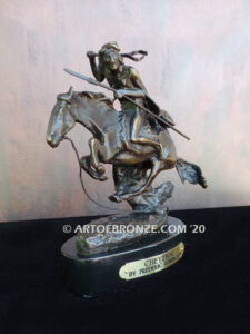 The Cheyenne bronze sculpture after Frederic Remington featuring warrior on galloping horse