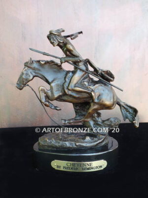 The Cheyenne bronze sculpture after Frederic Remington featuring warrior on galloping horse