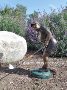 Chip Shot bronze statue of golfer girl chipping golf ball